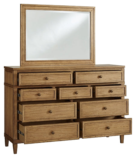 Sharlance Queen Upholstered Panel Bed with Mirrored Dresser